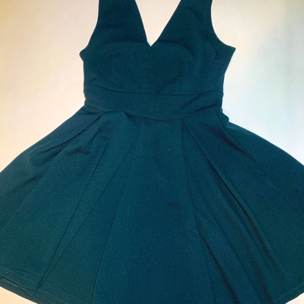 Green flowy dress with a small back opening